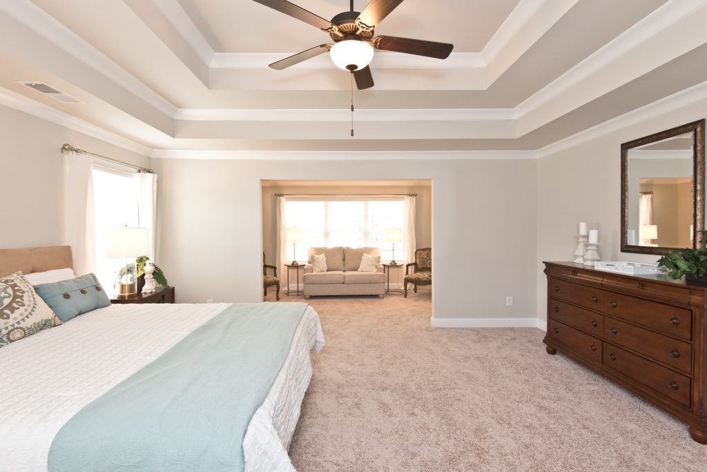 a sitting room inside a kerley family homes master bedroom